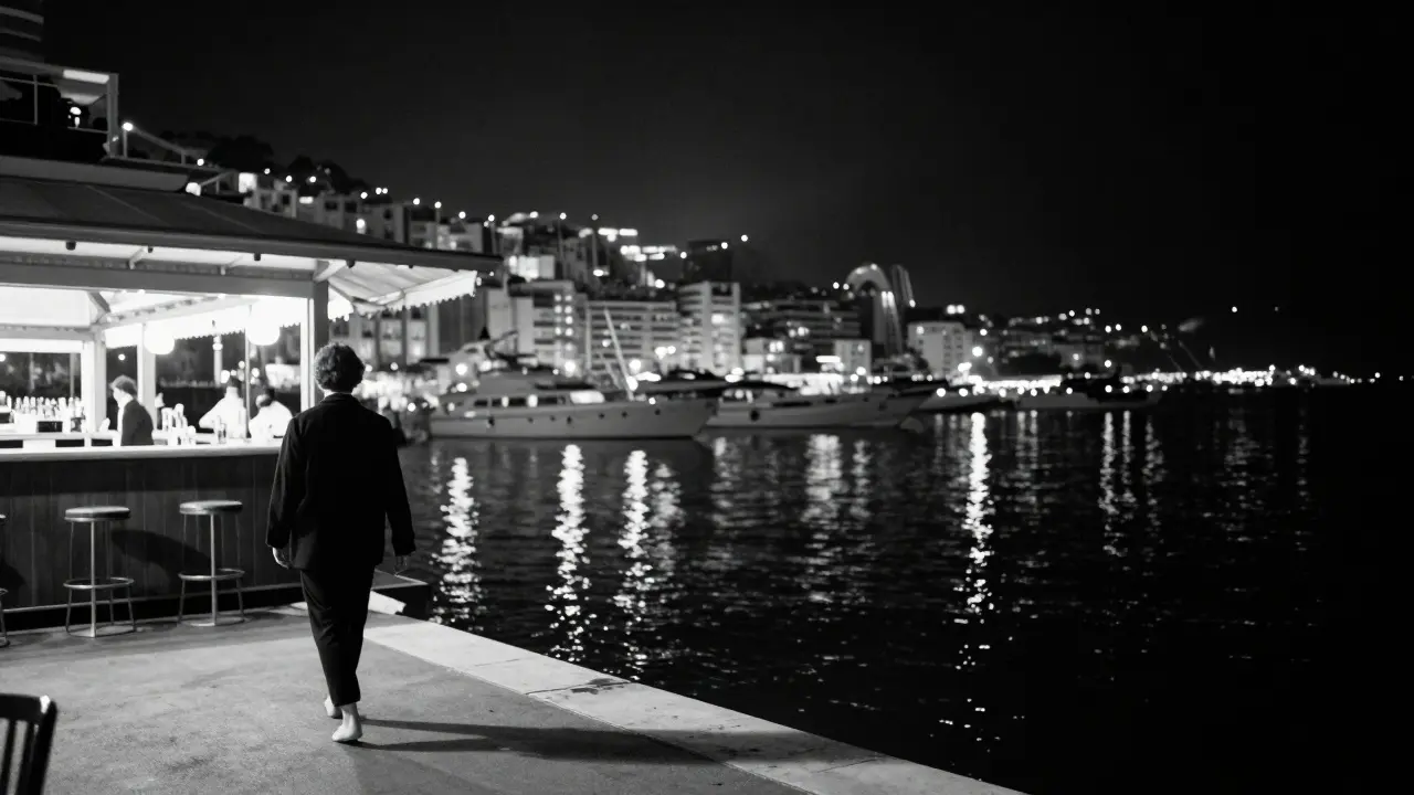 Solitary figure walking barefoot along a quiet harbor at night, yacht lights reflecting on still water.